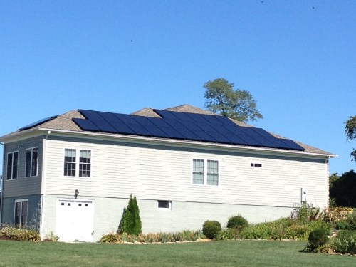 A whie house installed with solar panels